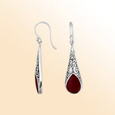 Silver teardrop earrings featuring Red Coral and ornate Bali scroll patterns.